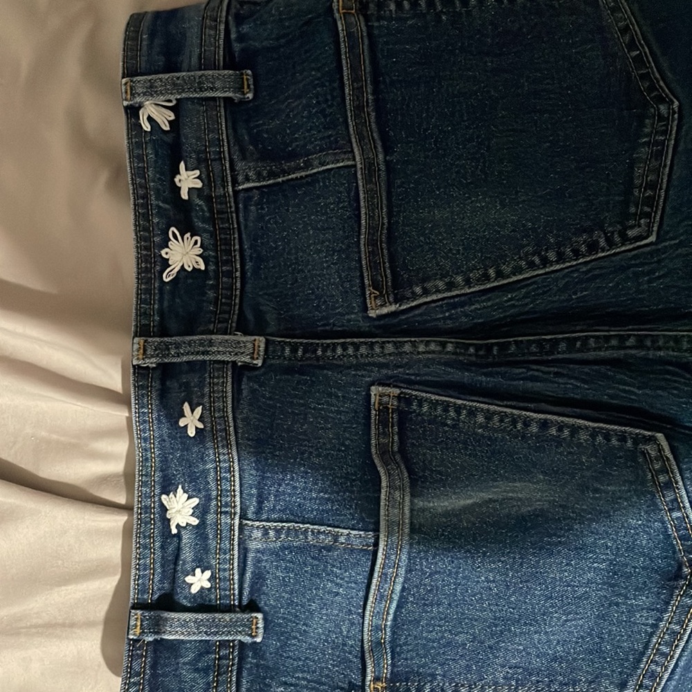 H&M: dark blue flare jeans w/ embroidered flowers